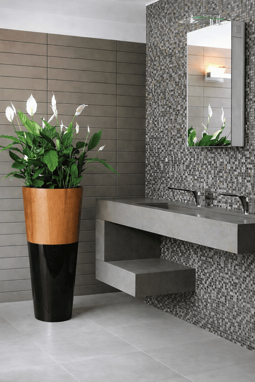 A cone-shaped planter made of veneer plywood, used for indoor plant decoration, placed in a modern office restroom area